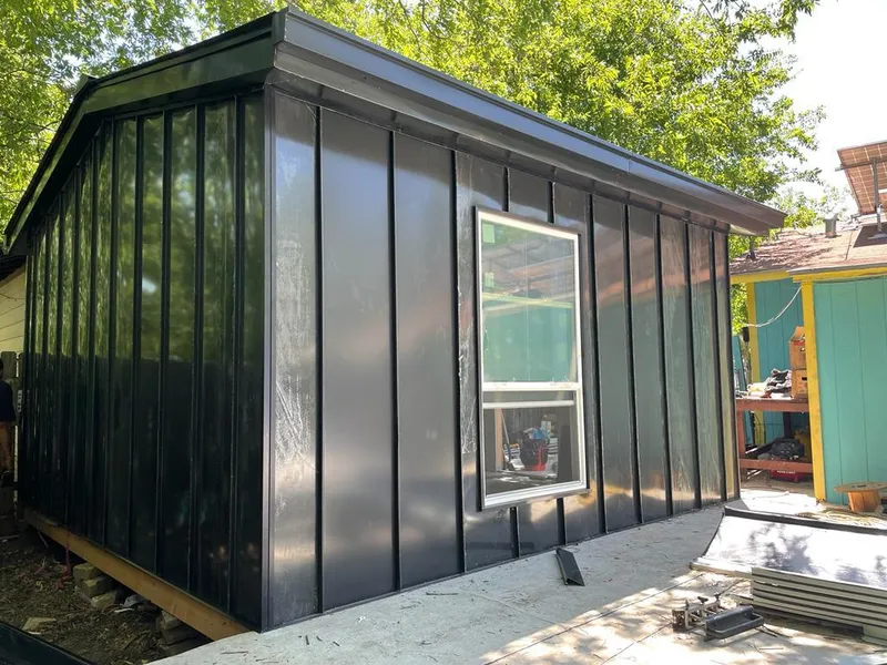 Black standing seam metal wall panels for Metal Roof Installation in Clovis